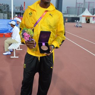 Hansel Parchment displays his bronze medal